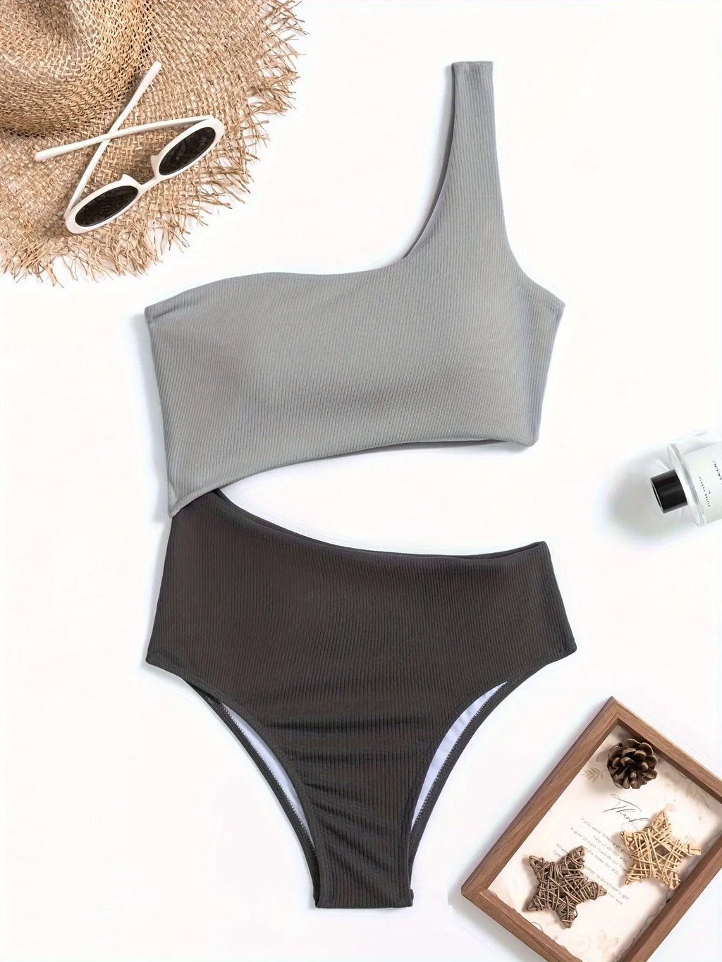 Women's light grey one-shoulder one-piece swimsuit on a mannequin.