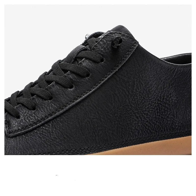 Men's black leather casual shoes with round toe and lace-up closure on a rubber sole