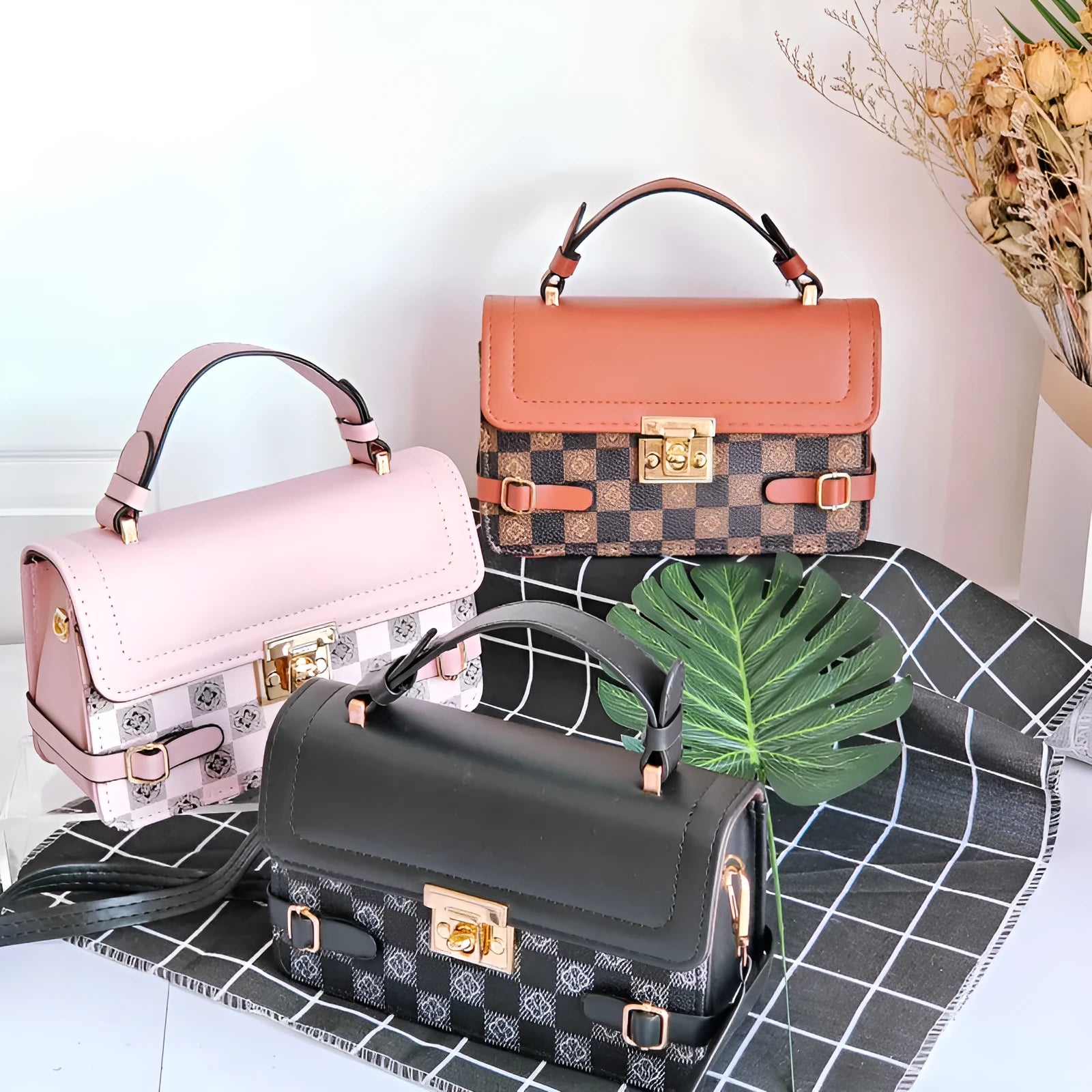 Small square retro pattern crossbody bag in PU leather with floral stitching.