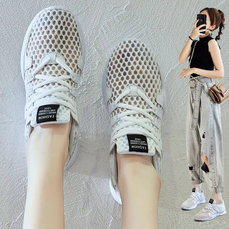 Breathable hollow-out mesh sneakers in black on a white background.