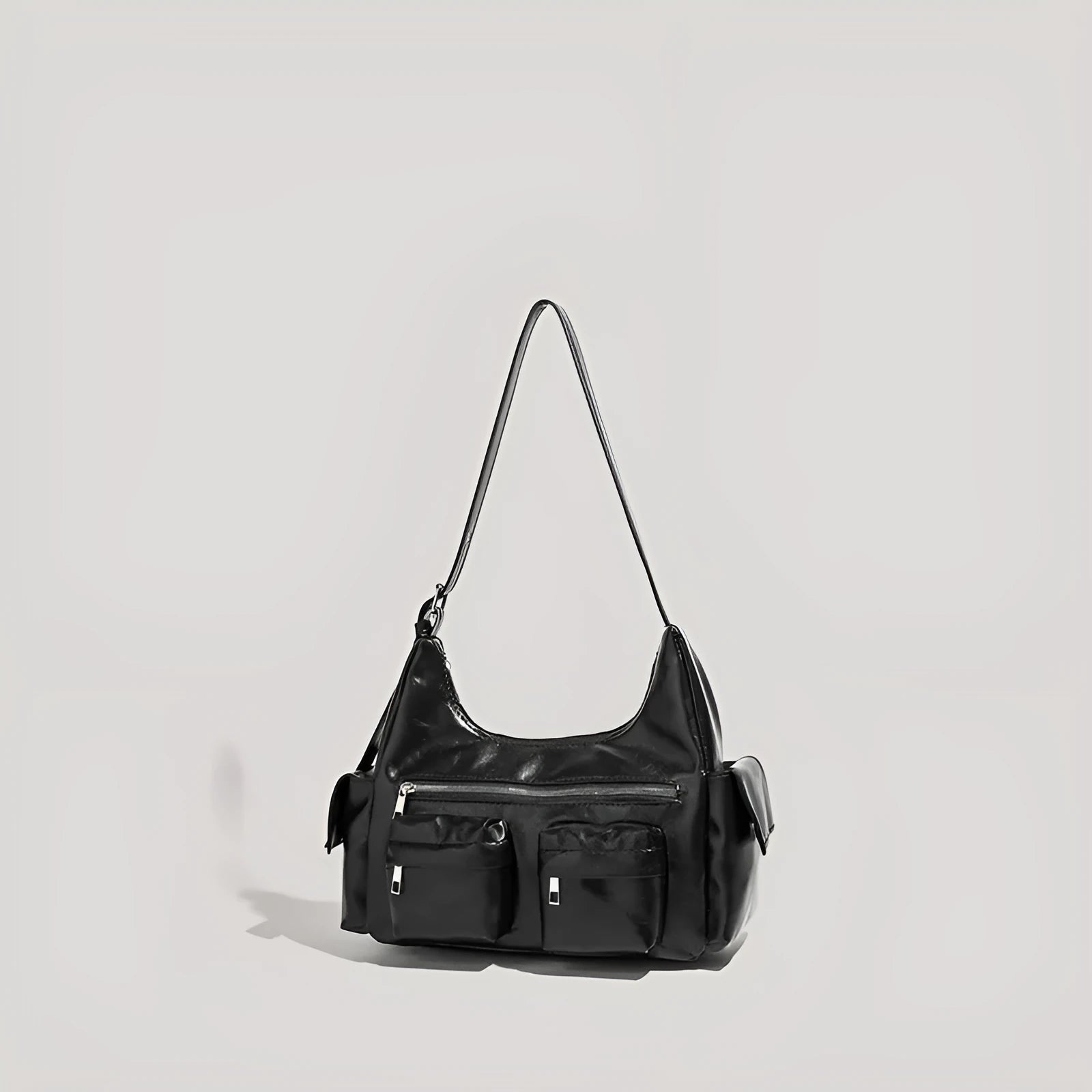 Black PU leather shoulder motorcycle bag with sewing line details against a plain background
