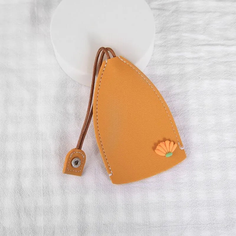 Cartoon design pull-out key case for car keys in PU leather.