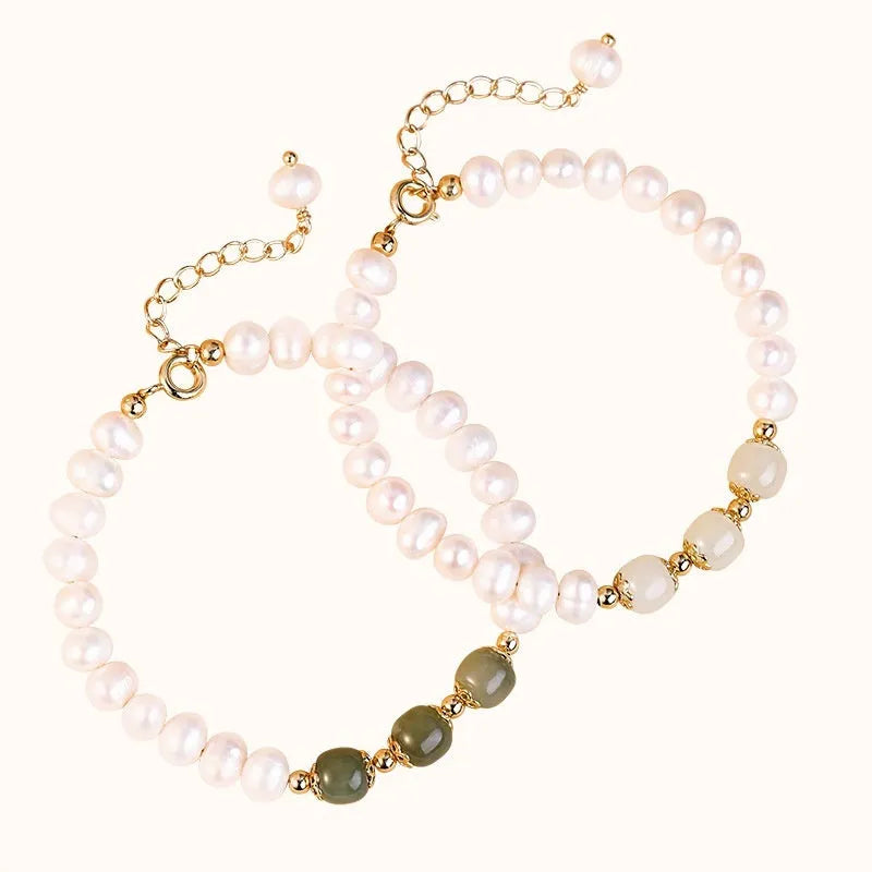 Korean style bracelet with diamond-shaped freshwater pearls in Hetian jade colour on a wrist.
