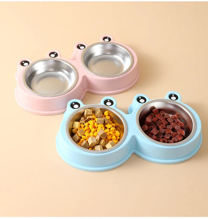Stainless steel frog-shaped double pet bowl for food and water, available in blue, green, or pink.