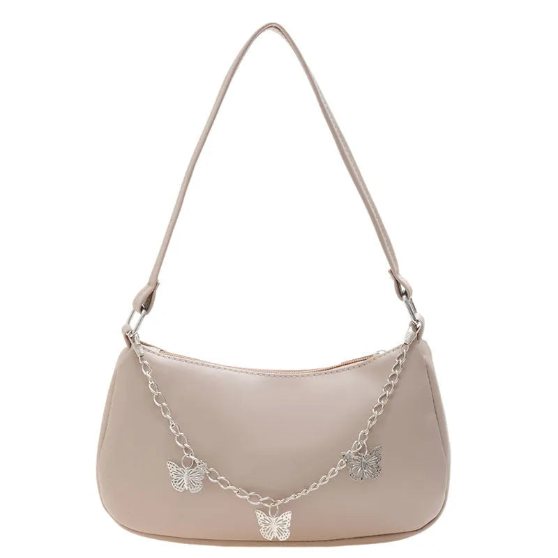 Black butterfly chain underarm bag with crossbody strap showing internal mobile phone and document compartments