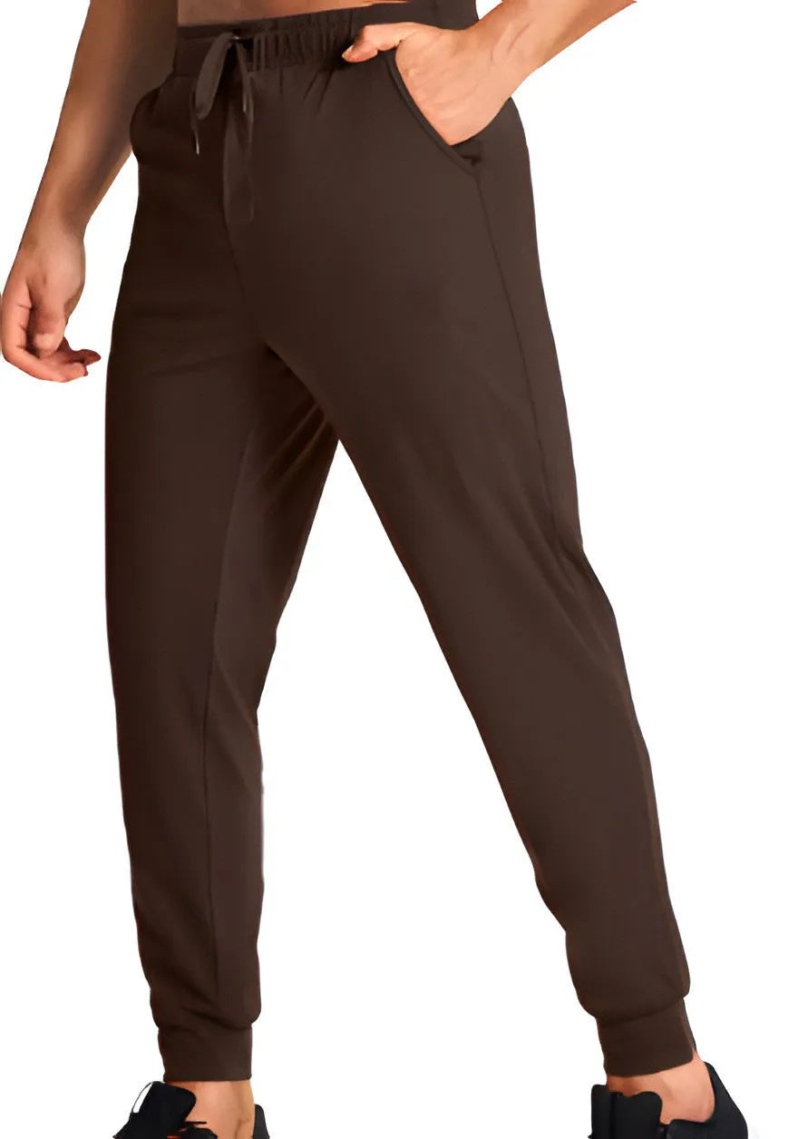 Men's loose fit casual polyester trousers in a solid colour, shown on a hanger.