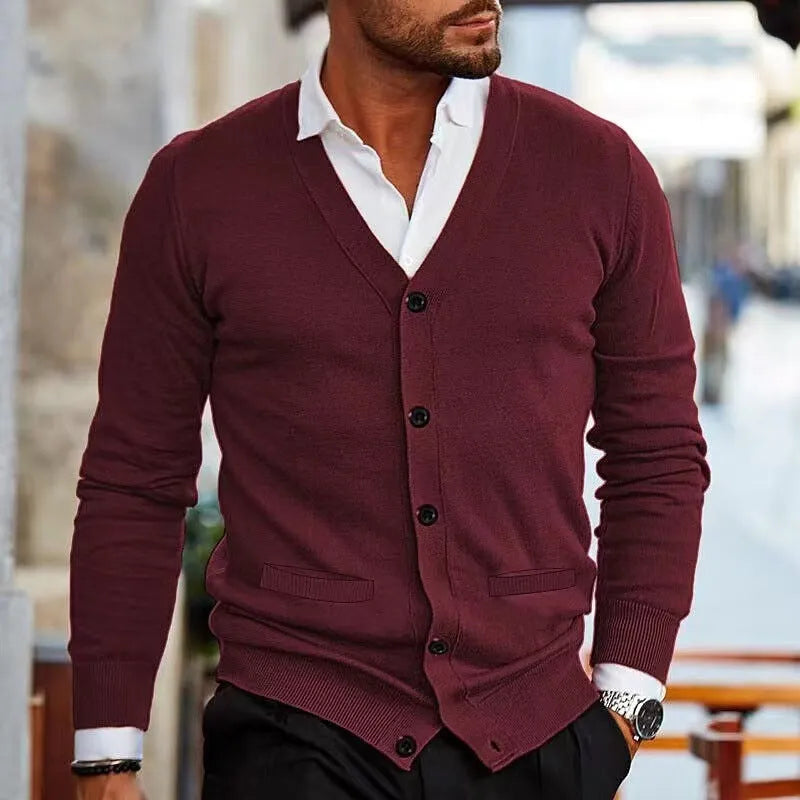 Men's slim fit acrylic cardigan in light grey shown on a model, featuring long sleeves and a button front.