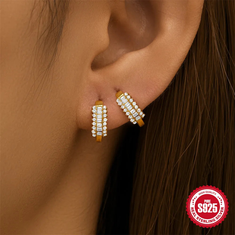 Sterling silver geometric stud earrings with circular diamond-style design in gold and silver electroplated finishes