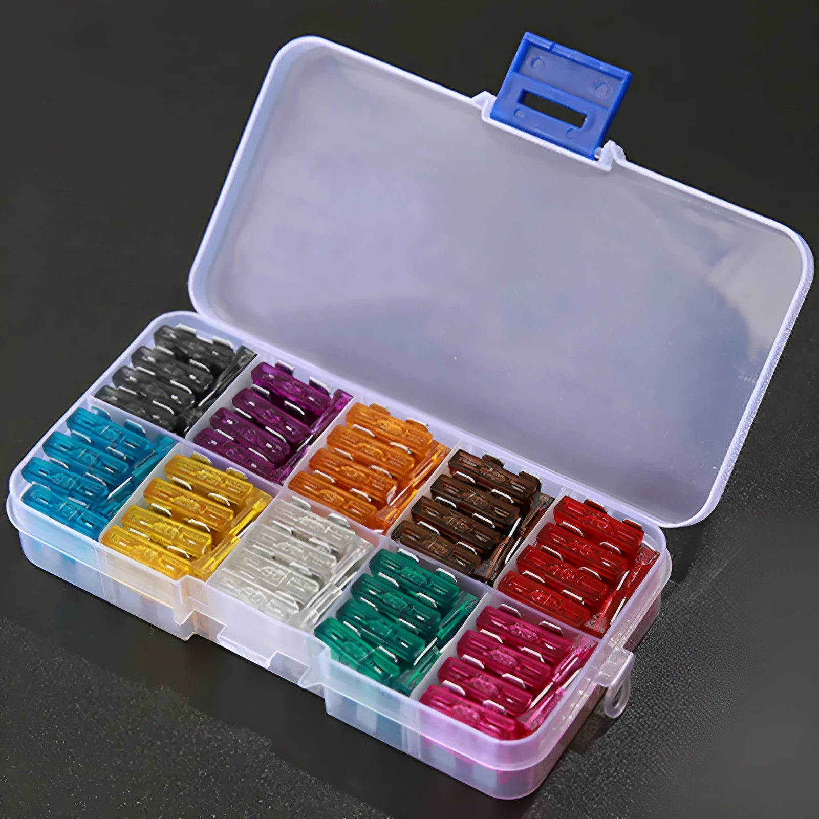 Box containing medium-sized plug-in fuses for automotive low voltage circuits