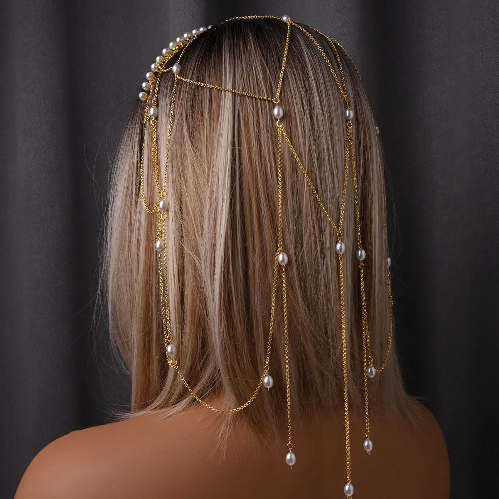 Gold and pearl mesh hair chain for women with a dangling tassel accessory.