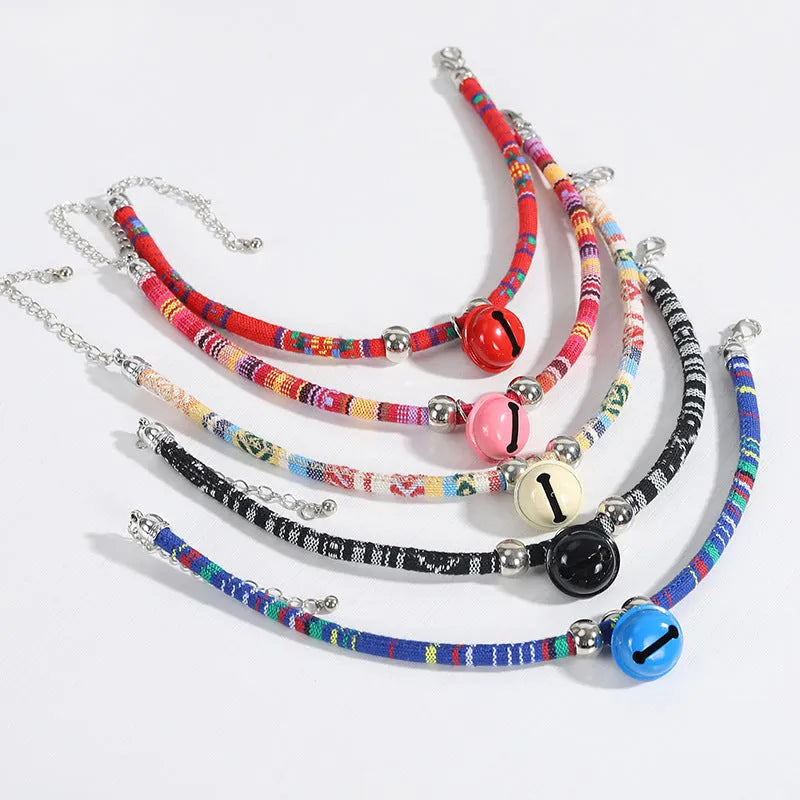 Coloured ethnic pattern adjustable pet collar with small bell for cats and dogs.