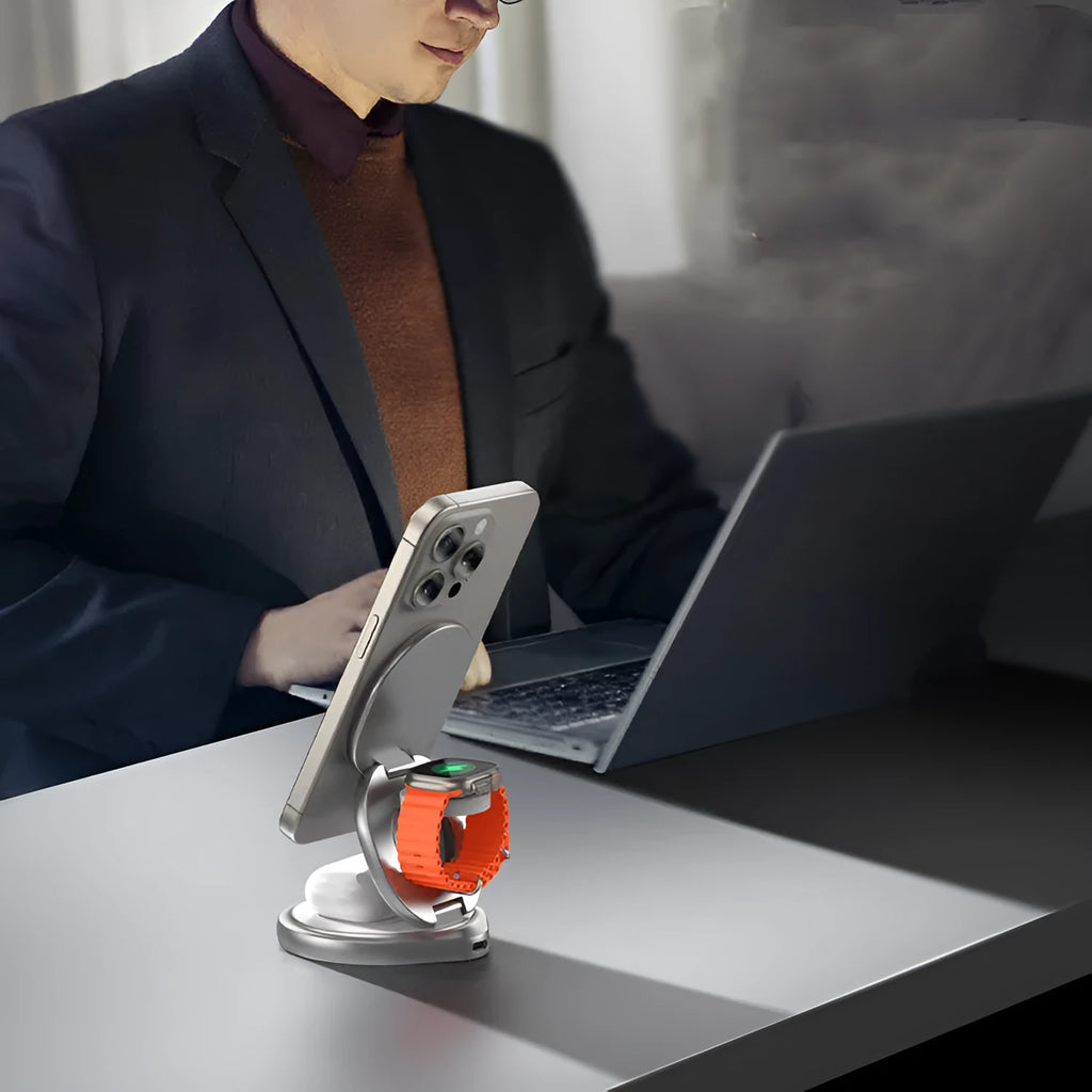 3-in-1 wireless charger magnetic folding stand in grey with phone and headphones charging on a desk