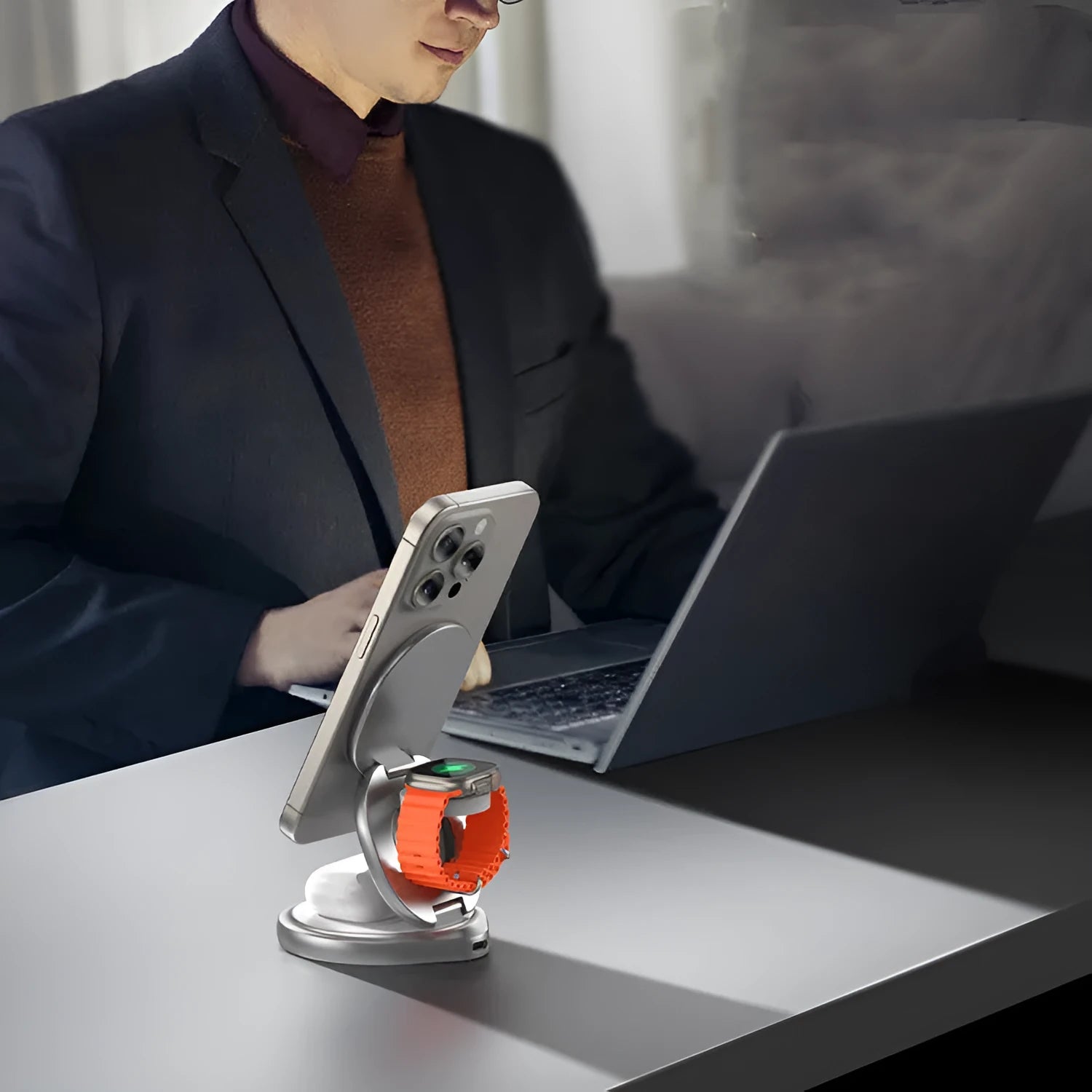 3-in-1 wireless charger magnetic folding stand in grey with phone and headphones charging on a desk