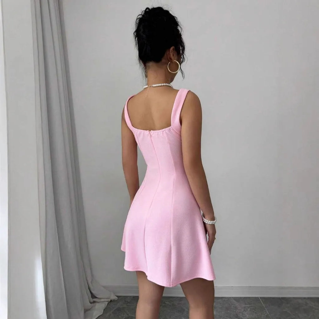 Pink high-waist A-line suspenders dress with short sleeveless skirt in polyester, shown on a model