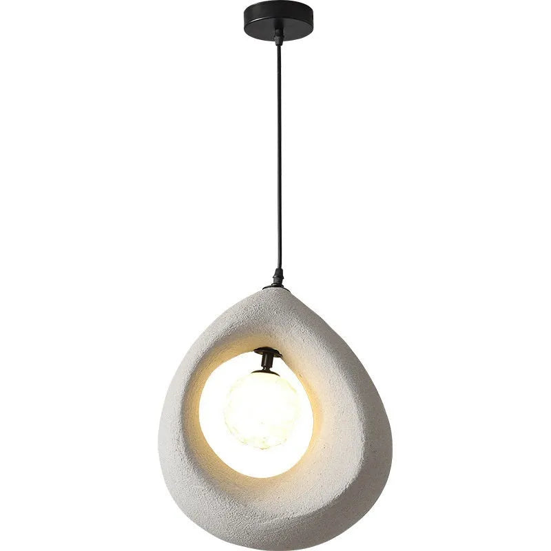 Modern pendant ceiling light with a wide milky white glass shade in a retro chandelier style.