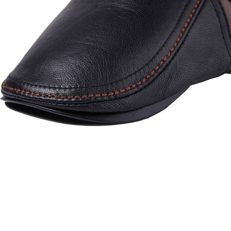 Men's cowhide leather beret peaked cap in dark brown with short brim on a neutral background
