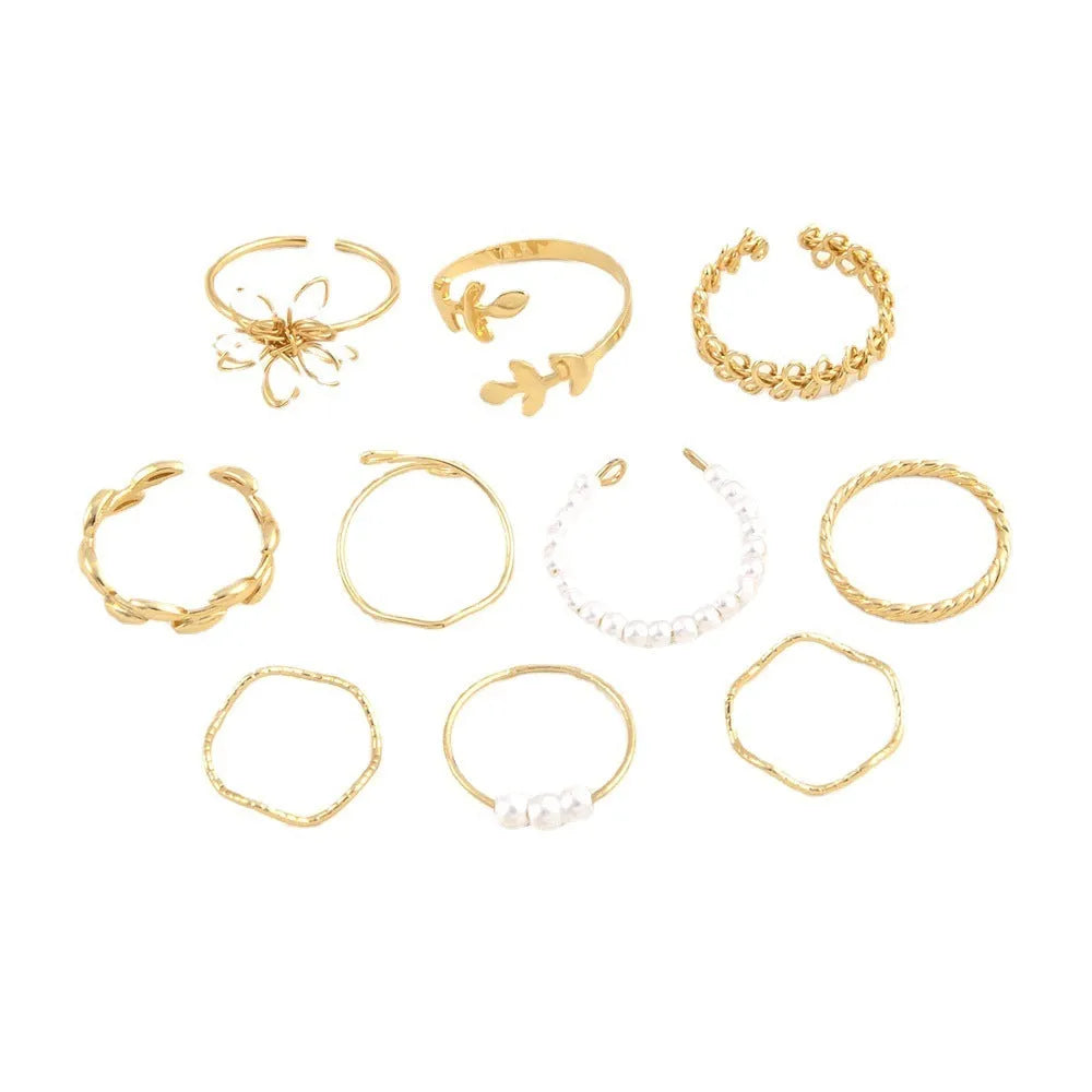 Gold-coloured alloy ring with openwork floral design and glossy electroplated finish