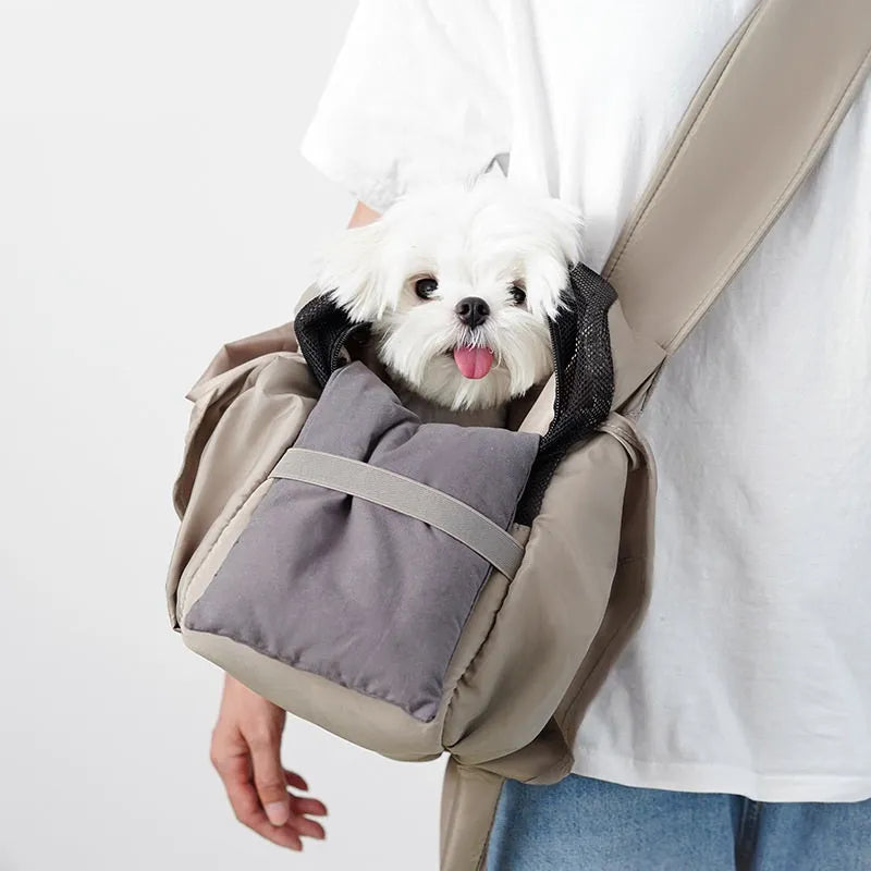 Apricot-coloured cloth pet carrier handbag for outdoor use with small pets.