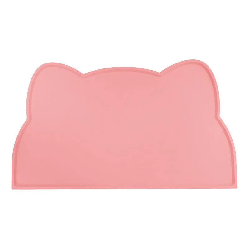 Solid colour silicone pet feeding mat placed under dog bowl on floor
