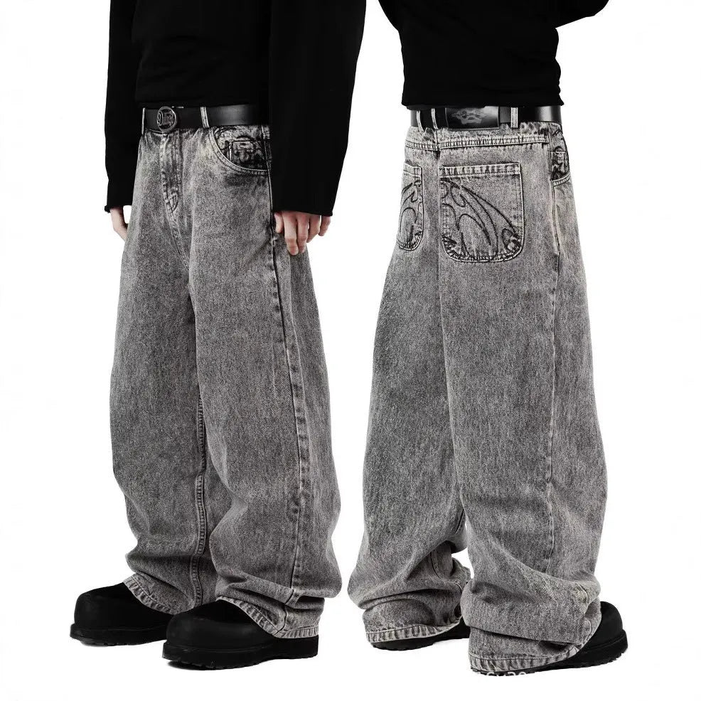 Grey loose-fit straight-leg cotton denim trousers on a mid-waist, shown from the front.