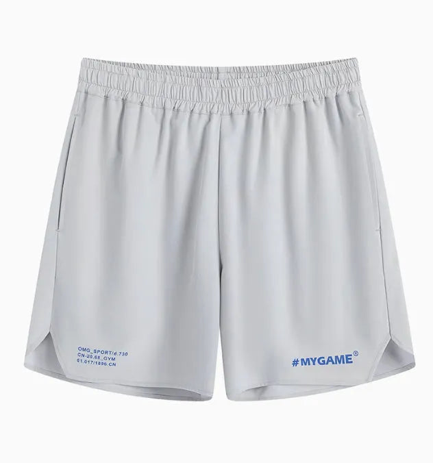 Men's grey fitness training shorts made of quick-dry polyester fabric on a plain background.