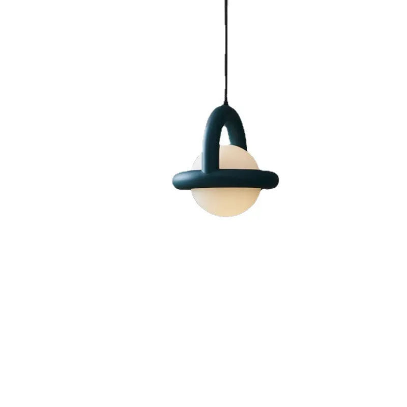 Danish designer Nordic hanging line lamp in green finish beside a bed.