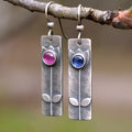 Red sapphire earrings with antique electroplated finish and geometric ellipse design