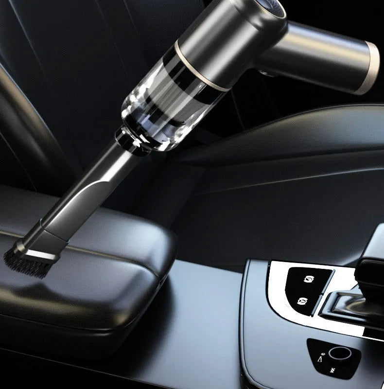 Black wireless handheld car vacuum cleaner with multiple nozzle attachments and USB charging cable