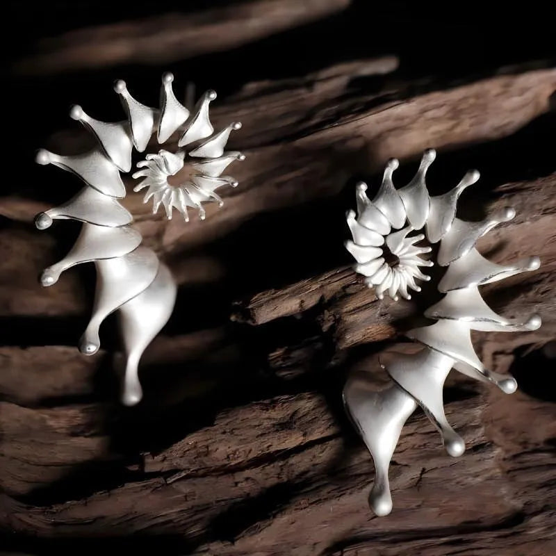 Matte finished conch stud earrings with three-dimensional alloy design