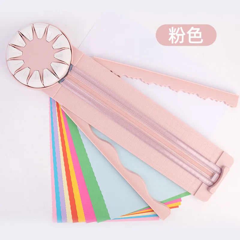 12-in-1 plastic paper cutting machine in pink colour on white background