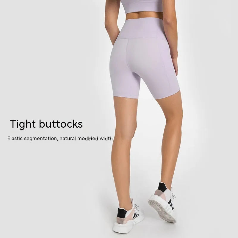 Women's solid colour sports shorts in a cotton blend fabric with super stretch, shown in a mid-length fit.