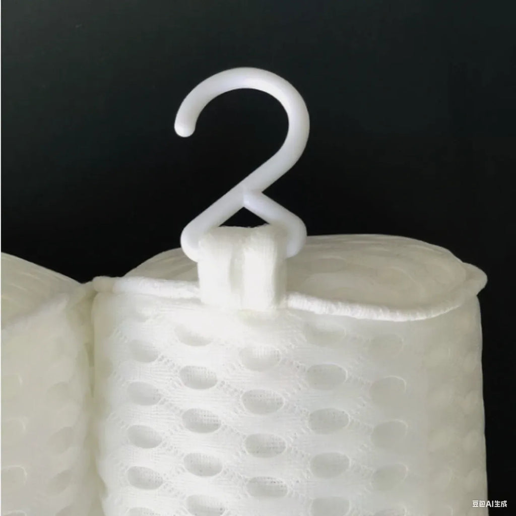 White bathtub pillow with 4D mesh fabric and multiple suction cups on a tub.