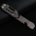 Titanium alloy multi-function crowbar tool with integrated bottle opener in gun grey or stone wash finish.