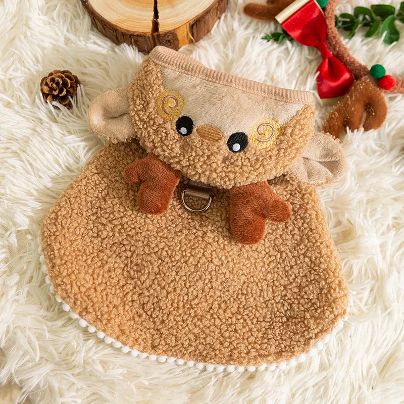 Green granular velvet cat cape with Christmas tree hat and star, lying on a white background