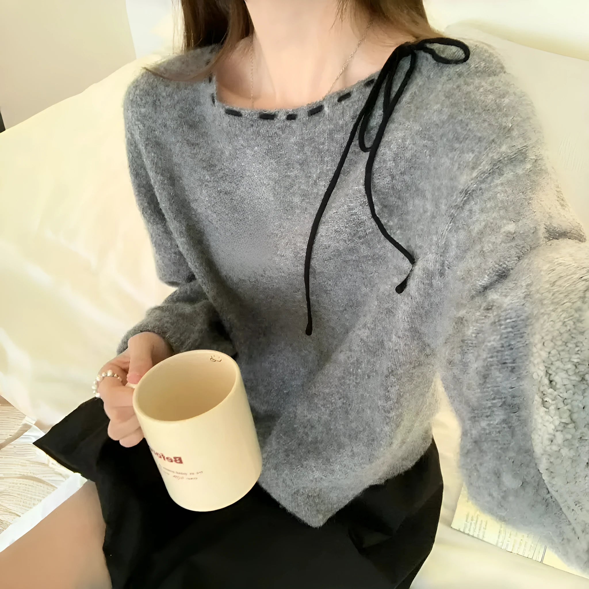 Women's grey loose fit V-neck knitwear pullover jumper on hanger