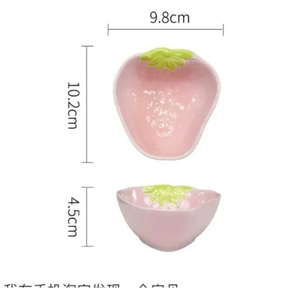 Cute strawberry-themed porcelain dinnerware set with flower bowl, straw hat plate, disc, and twist spoon.
