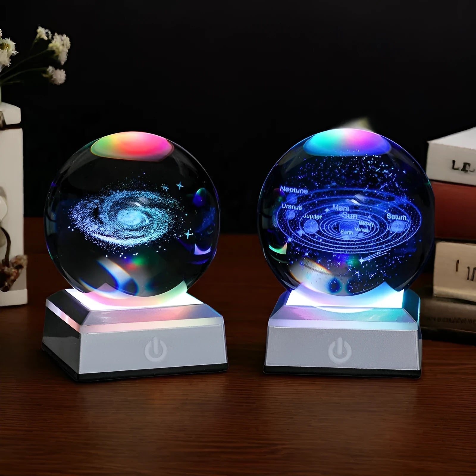 Transparent white crystal ball night light with 3D inner carving of Milky Way on black square colourful base