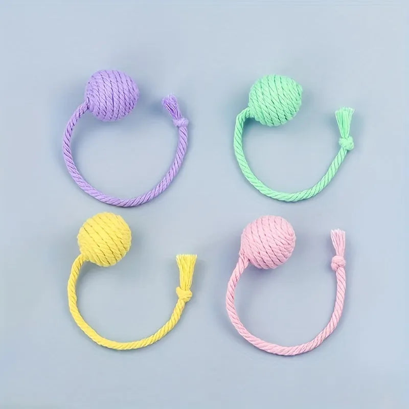 Cat toy ball with rope and bell in green pink purple yellow colours showing 3cm and 6cm size options