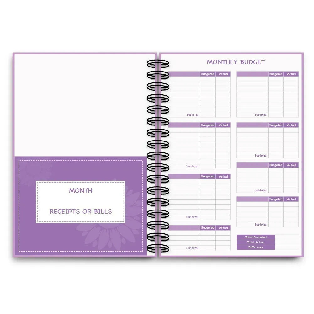 Purple coil-bound financial planning notebook with stickers, pen, and paper clips for monthly budget tracking