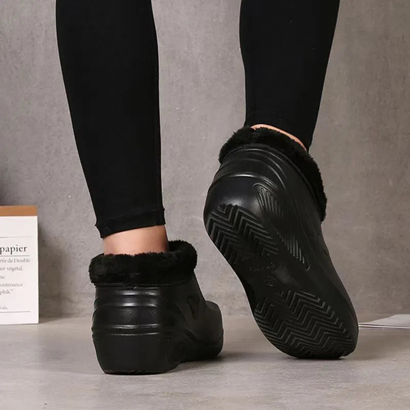 Unisex waterproof fleece-lined rain boots with anti-slip EVA sole in black, side view