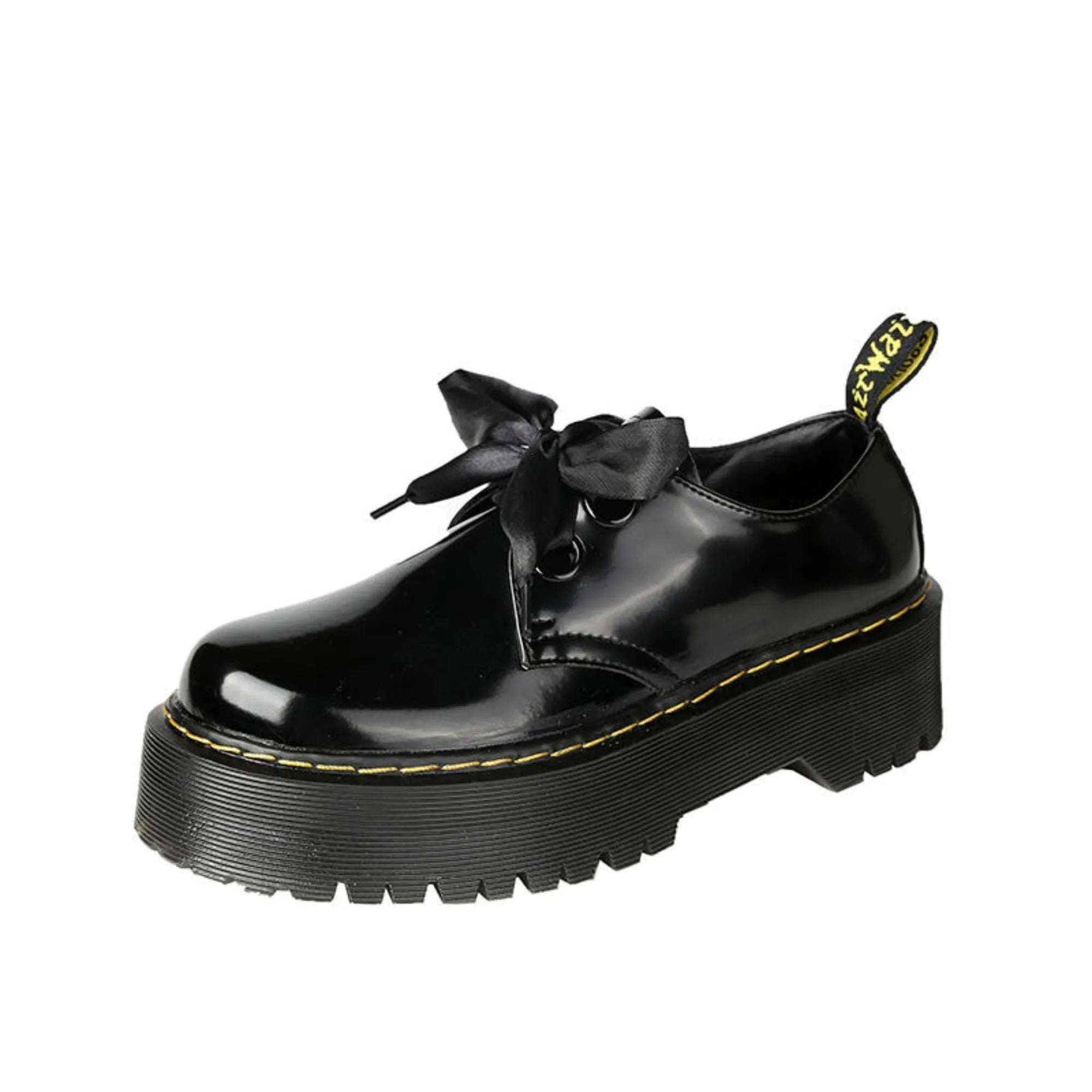 Women's thick-soled black shoes with cross strap and ribbon detail, lace-up closure