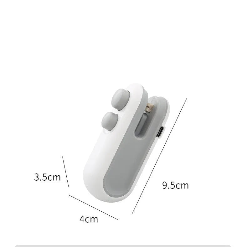 White and blue handheld USB rechargeable vacuum heat sealer with magnetic back