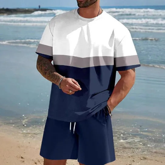 Man wearing a loose fit short-sleeved t-shirt and shorts summer suit in a solid colour.