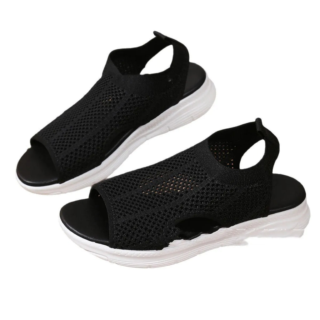 Women's black platform sports sandals with mesh lining and a flat toe bracket on a rubber sole.