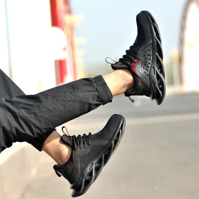 Men's anti-puncture safety sneakers with steel toe, lace up, black, breathable fly woven upper and EVA sole