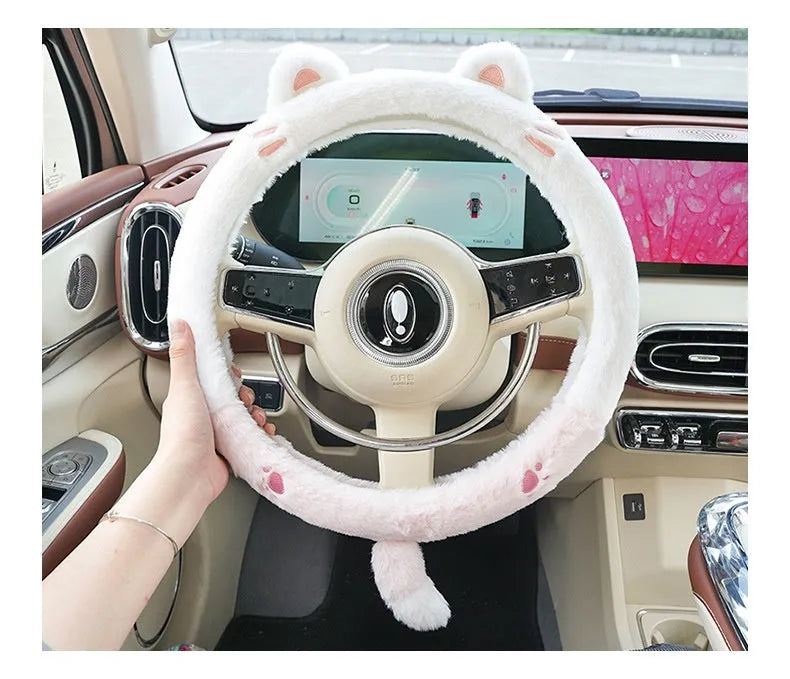 Plush rabbit fur steering wheel cover with embroidered cartoon design, shown fitted on a 38cm wheel.