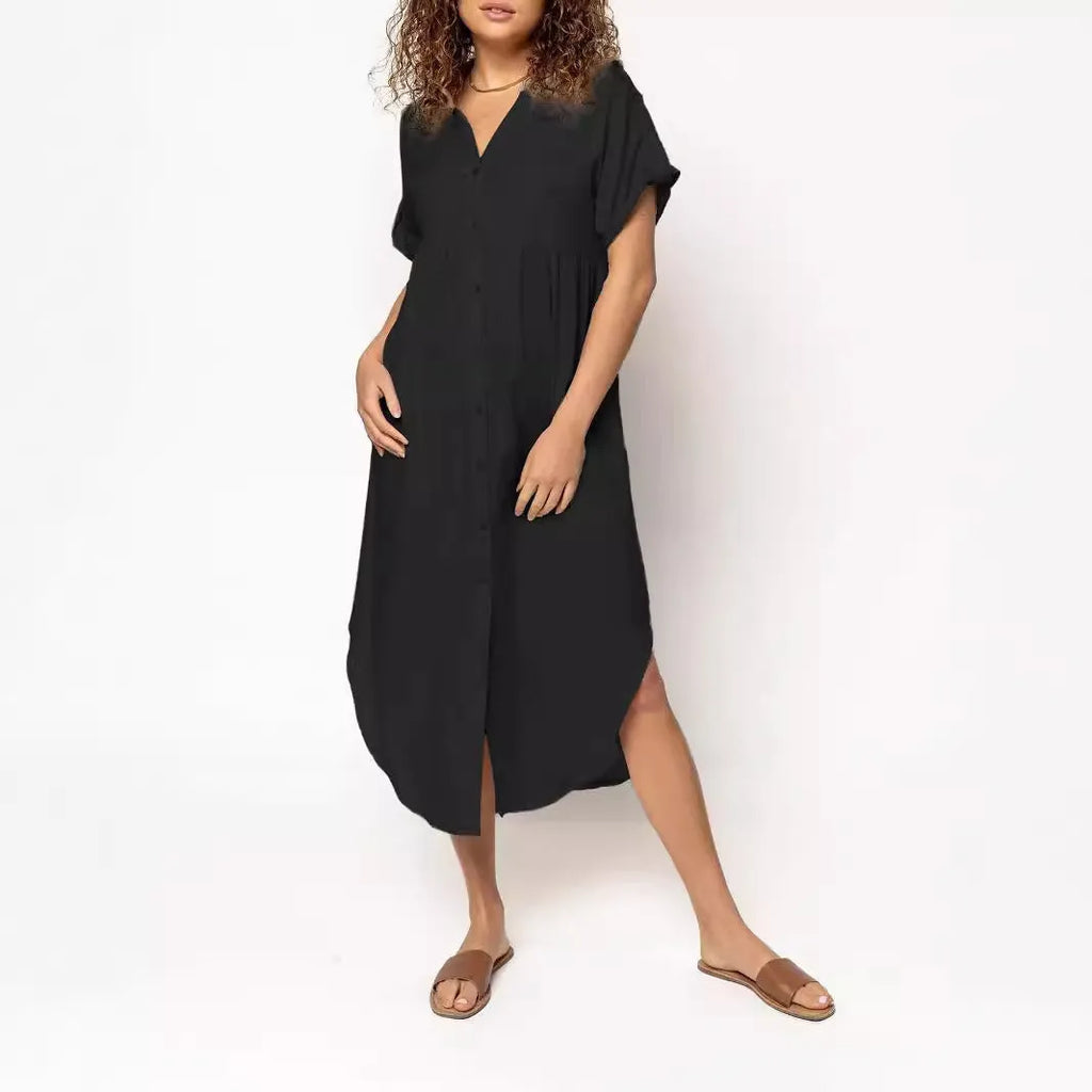 Casual solid colour mid-length dress with button front closure on a hanger.