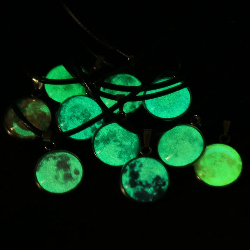 Luminous moon and constellation night sky pendant on an extendable alloy necklace chain.