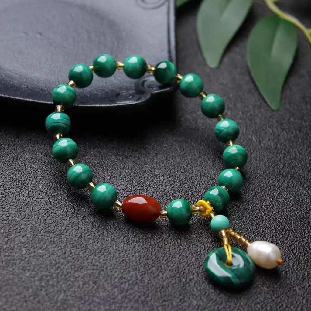Natural malachite and red agate bracelet with 7-8mm barrel beads on wrist