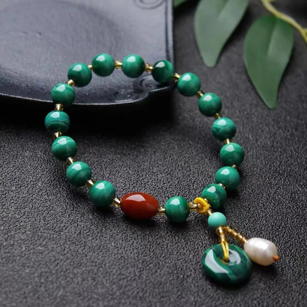 Natural malachite and red agate bracelet with 7-8mm barrel beads on wrist